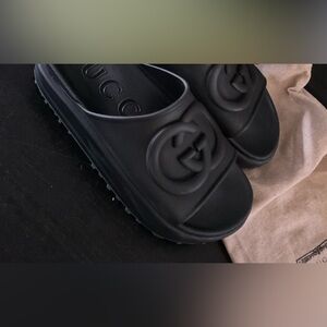 Black platform Gucci slides, size 10